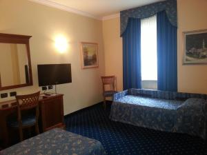 Postel nebo postele na pokoji v ubytování Albergo Costantini