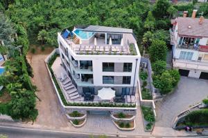 an overhead view of a house with a swimming pool at Apartments in Villa Ziza, rooftop swimming pool in Opatija