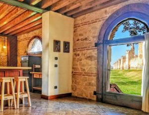 a room with a large window with a view of a castle at Medieval Relais - Top location in Montagnana
