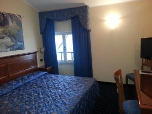 Postel nebo postele na pokoji v ubytování Albergo Costantini