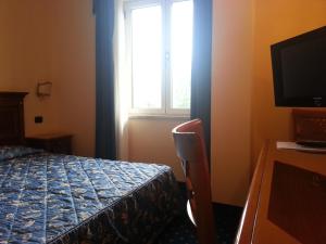 Postel nebo postele na pokoji v ubytování Albergo Costantini