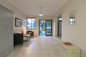 a living room with a couch and a table at Eastbrook River Self Catering Cottages in Sedgefield
