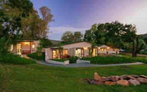 a house with a garden at night at Eastbrook River Lodge in Sedgefield