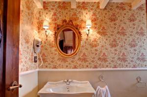 a bathroom with a sink and a mirror at Hotel Boutique Real Posada De Liena y Restaurante Liena in Murillo de Gállego +37 photos