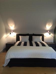 Rúm í herbergi á Guesthouse Villa Vauban