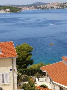 a view of the water from a house at Holiday Apartment Lucic - SEA VIEW - Peaceful - Family Friendly - Near Beach in Ražanj