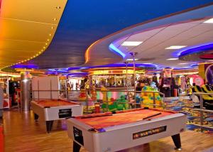 a gaming room with two billiard tables in a casino at S460 8 BERTH CARAVAN ON THE GOLDEN PALM CHAPEL ST LEONARDS in Chapel Saint Leonards