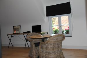 Sjónvarps- og/eða afþreyingartæki á Guesthouse Villa Vauban