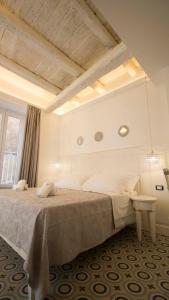 a bedroom with a large bed and a window at BellaVita accomodation in Tropea