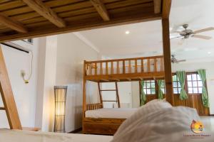 a bedroom with a bunk bed in a room at Lanas Beach Resort Carabao Island in San Jose +113 photos
