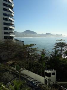 a view of the ocean from a building at Guaruja Apartment in Guarujá