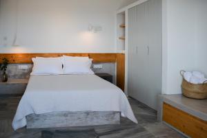 Postel nebo postele na pokoji v ubytování Pharos Apartments