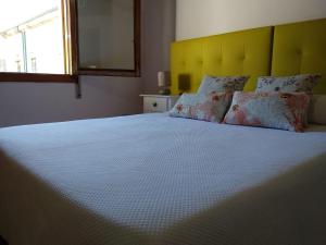 מיטה או מיטות בחדר ב-O Tipico
