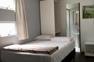 Postel nebo postele na pokoji v ubytování NUMAR Hotel