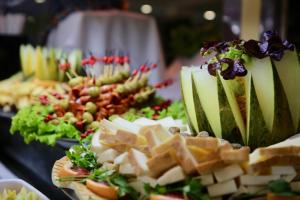 a buffet of food with cheese and other appetizers at Hotel Puerto Palace in Puerto de la Cruz
