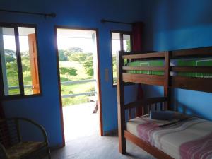 Rúm í herbergi á Hostal Casa Las Lajas