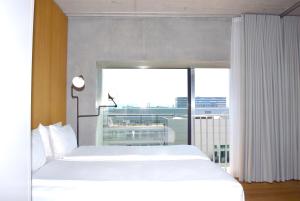 Letto o letti in una camera di Placid Hotel Design & Lifestyle Zurich