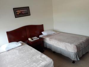 Letto o letti in una camera di Hotel Doral