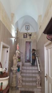 a staircase in a room with a stair case at Il Castello te Lu Sannà B.&B. in Merine