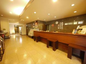 a fast food restaurant with a counter and benches at Hotel Route-Inn Kamisuwa in Suwa