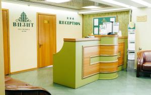 a lobby of a hospital with a reception counter at Hotel Visit in Chita