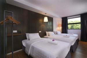 Postel nebo postele na pokoji v ubytování T+ Hotel Butterworth