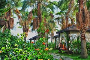 A garden outside Mukarnas Spa & Resort Hotel