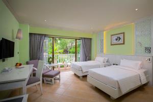 Кровать или кровати в номере Aonang Villa Resort I Beach Front