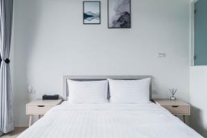 Postel nebo postele na pokoji v ubytování Boléro Homestay I 鄰近花園夜市