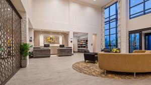 an office lobby with chairs and tables and windows at Best Western Plus Cranberry-Pittsburgh North in Cranberry Township