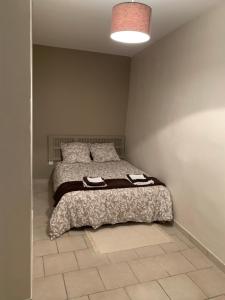 מיטה או מיטות בחדר ב-Clos Augusta 2