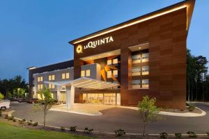 a building with aania sign on the front of it at La Quinta by Wyndham Rock Hill in Rock Hill