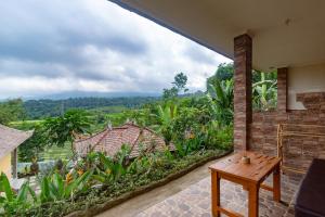 
a view from a balcony of a house at Pondok Nyoman in Bedugul
