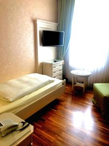 Postel nebo postele na pokoji v ubytování Mokni's Palais Hotel & SPA