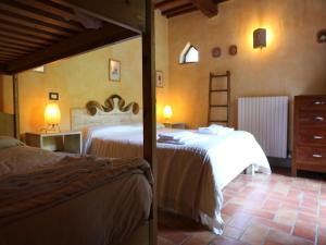 Postel nebo postele na pokoji v ubytování Agriturismo Borgo Santa Maria + 37 fotografií