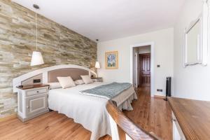 Ένα ή περισσότερα κρεβάτια σε δωμάτιο στο Hotel de Montaña El Mirador