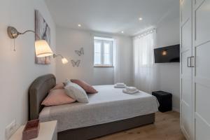 Ένα ή περισσότερα κρεβάτια σε δωμάτιο στο Kuća Redini