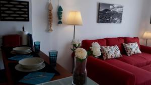 A seating area at Aqua Apt Sunrise & Sea Views