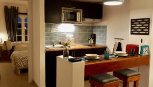 A kitchen or kitchenette at Aqua Apt Sunrise & Sea Views