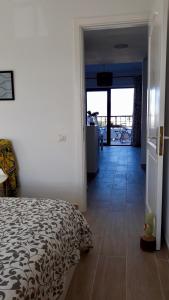 A bed or beds in a room at Aqua Apt Sunrise & Sea Views