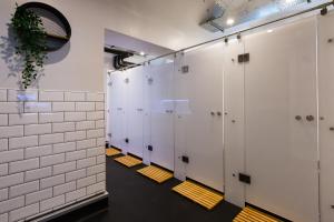 a row of white lockers in a room at CoDE Pod – The CoURT - Edinburgh in Edinburgh