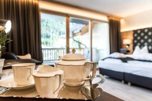 Postel nebo postele na pokoji v ubytování Wellness Hotel Gran Risa***S