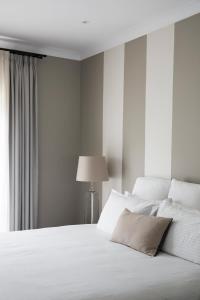 Lancemore Lindenderry Red Hill客房内的一张或多张床位