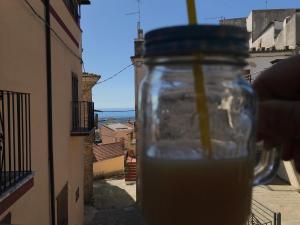 a mason jar sitting on top of a street at Il Giglio Casa Albergo in Rotondella