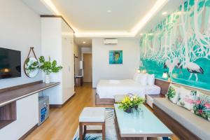 a hotel room with a bed and a couch at Nexy Living in Hanoi