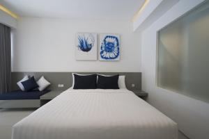 Postel nebo postele na pokoji v ubytování The Rooms Apartment Bali by ARM Hospitality