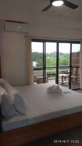 Postel nebo postele na pokoji v ubytování Jalyn's Resort Sabang