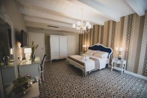Voodi või voodid majutusasutuse Sui Generis Tropea Luxury Rooms toas