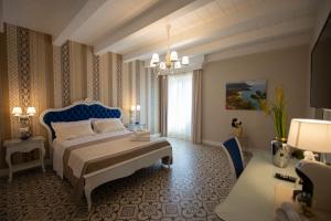 Voodi või voodid majutusasutuse Sui Generis Tropea Luxury Rooms toas
