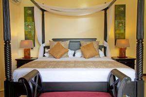 Ein Bett oder Betten in einem Zimmer der Unterkunft The Palm Seychelles